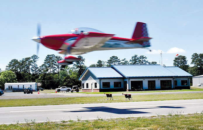 Morris “Mo” Meeker in his aerobatic plane